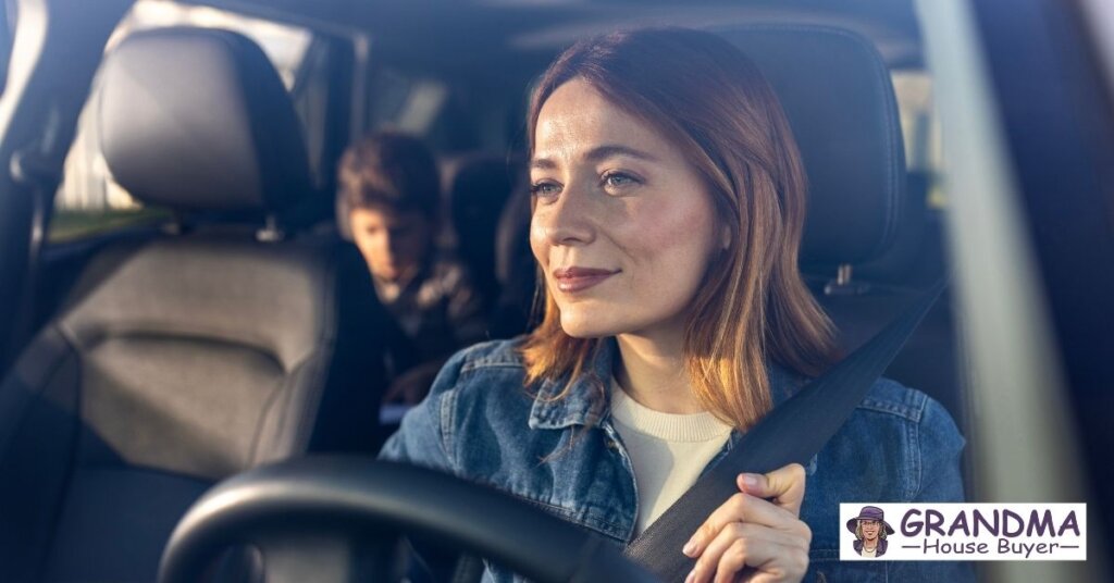 woman driving in sugar land tx with a kid in the back seat pondering rising foreclosure rates